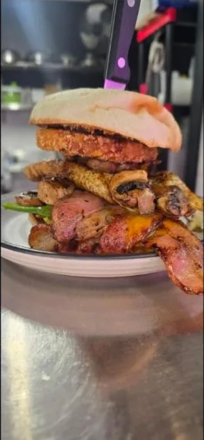 The big brekkie roll stacked with hash brown, mushrooms, bacon and egg