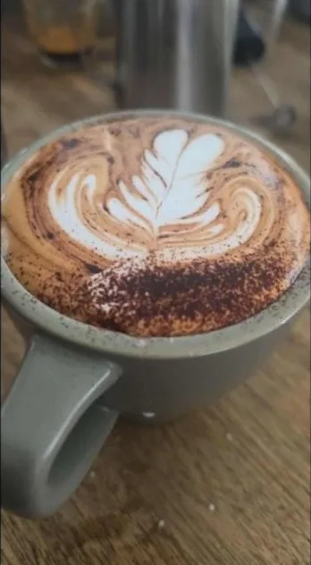 A cappuccino with a rosetta in the milk